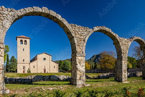San Vincenzo al Volturno, a Benedictine monastery in Castel San Vincenzo and Rocchetta a Volturno. The new abbey. The remains of walls of an ancient building, with a series of stone arches. photo