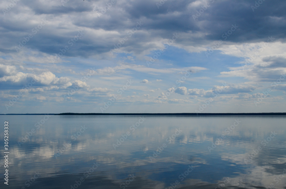 Blue clouds reflection in the water