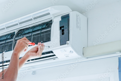 Air conditioner repairing by technician photo