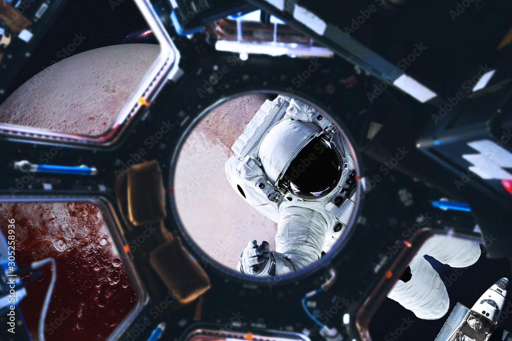 Obraz premium Astronaut near Planet Pluto of Solar system in space with far galaxy on the background. View from space station illuminator. Spaccewalk concept. Elements of this image were furnished by NASA 