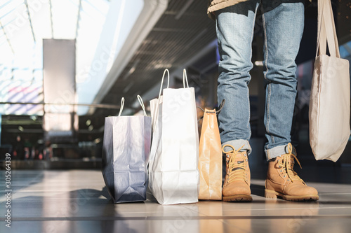 Canvas Print A busy shopper, concept of consumerism and wasting money