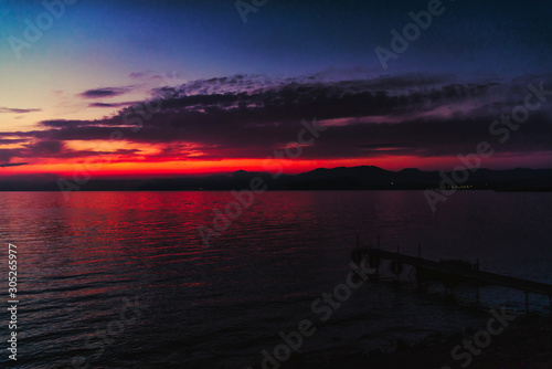 Fototapeta Naklejka Na Ścianę i Meble -  Deep blue red sunset over the sea