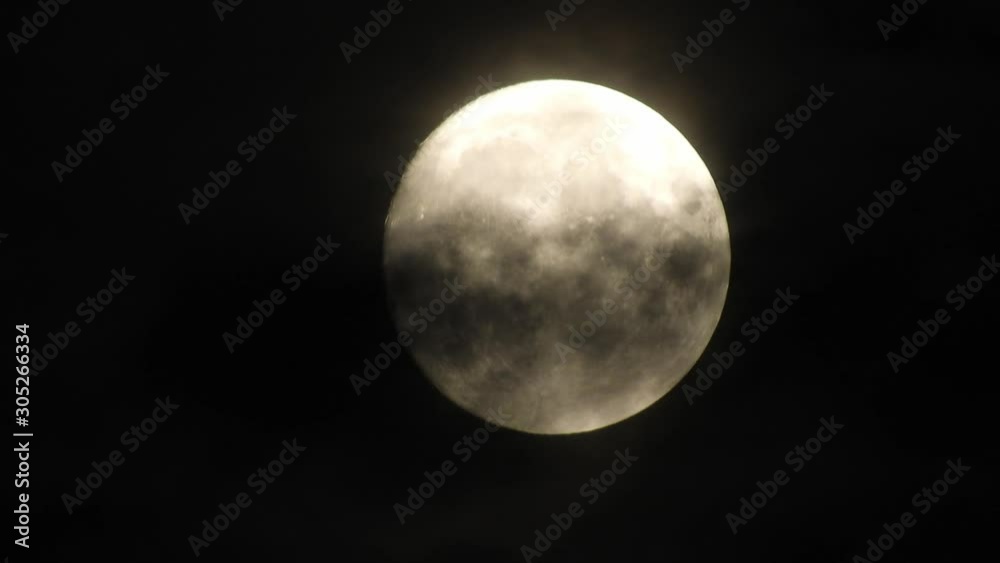 moon at night with cloud real time. 4k video full moon in the black sky. Clouds passing by moon at night. night sky with cloudy weather moon at night with cloud real time. 4k video full moon in the black sky. Clouds passing by moon at night. night sky with cloudy weather