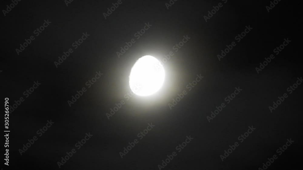 moon at night with cloud real time. 4k video full moon in the black sky. Clouds passing by moon at night. night sky with cloudy weather moon at night with cloud real time. 4k video full moon in the black sky. Clouds passing by moon at night. night sky with cloudy weather