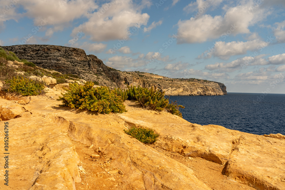 view of malta coast and mediterranean sea at blue grotto, malta