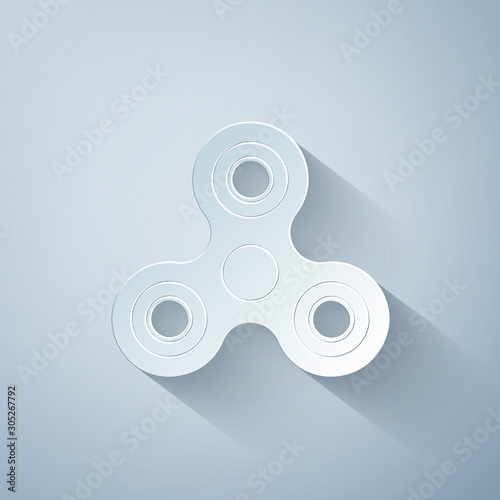 Paper cut Fidget spinner icon isolated on grey background. Stress relieving toy. Trendy hand spinner. Paper art style. Vector Illustration
