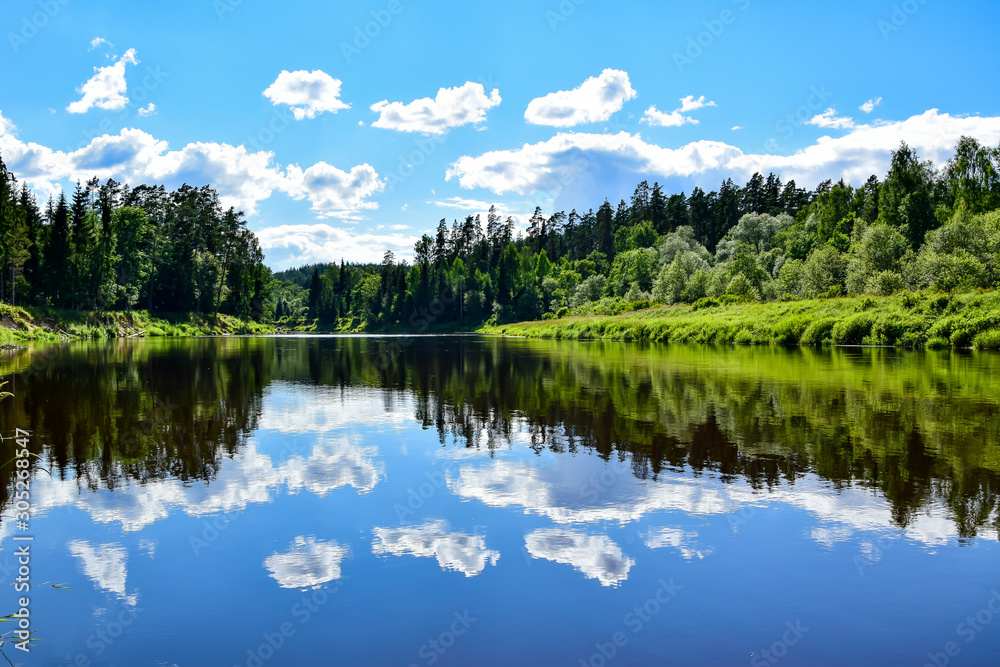 Sky reflection in the mirror water of the Gauja river. Sky reflection in the mirror water of the Gauja river.