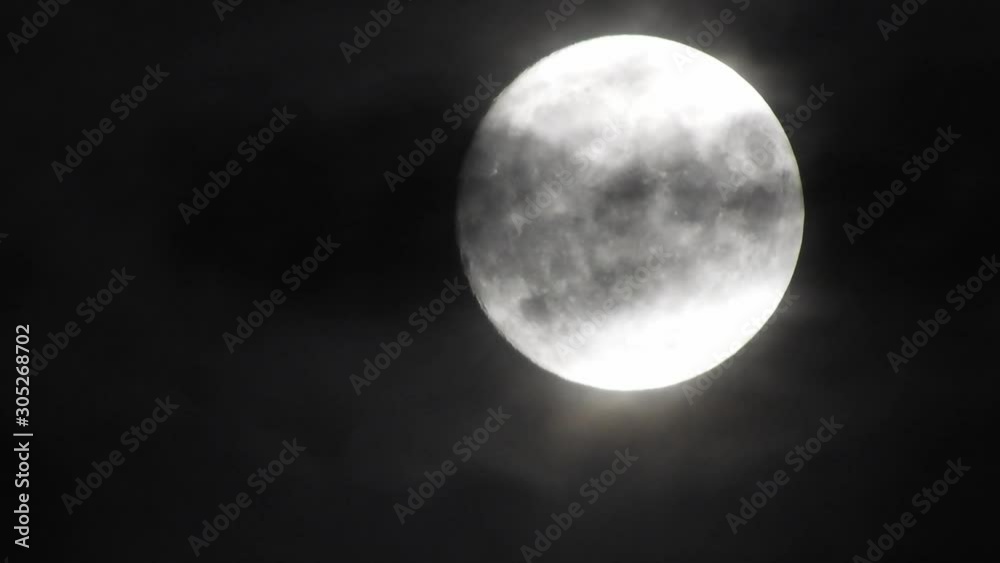 moon at night with cloud real time. 4k video full moon in the black sky. Clouds passing by moon at night. night sky with cloudy weather moon at night with cloud real time. 4k video full moon in the black sky. Clouds passing by moon at night. night sky with cloudy weather