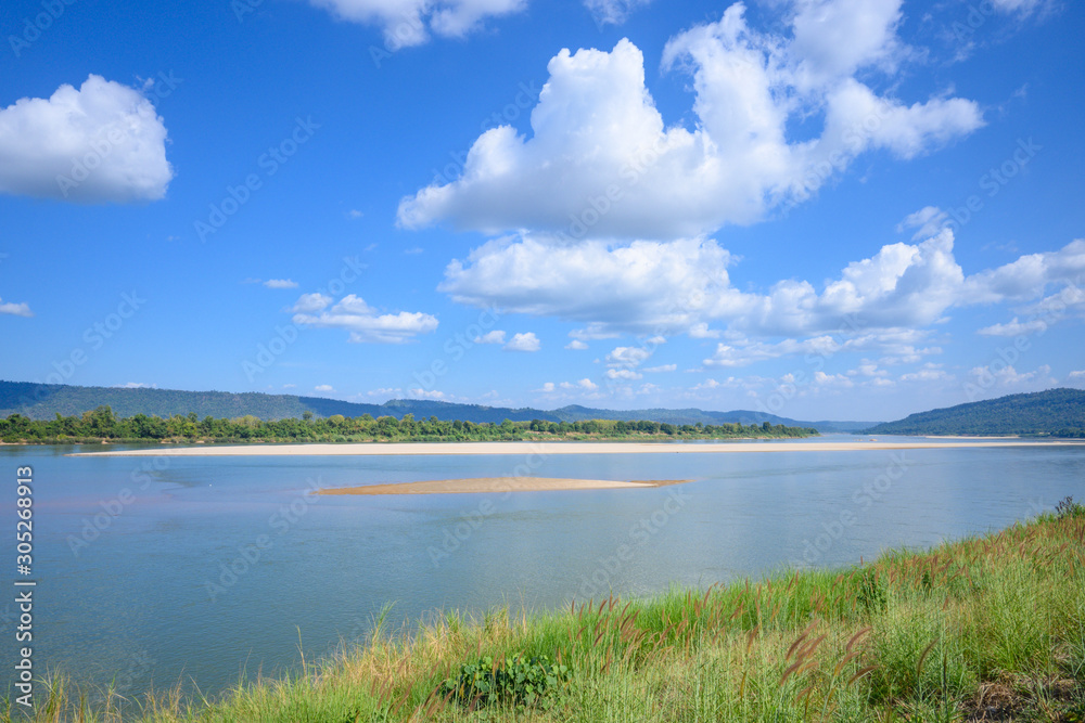 Landscape of river and mountain with blue sky.