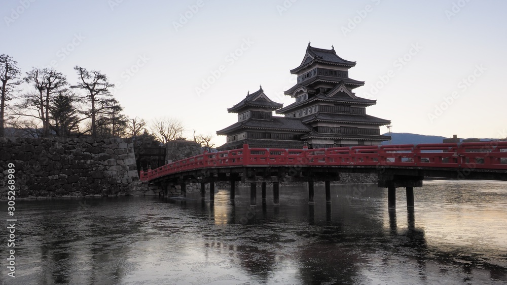 Matsumoto castle and red bridge in the morning Matsumoto castle and red bridge in the morning