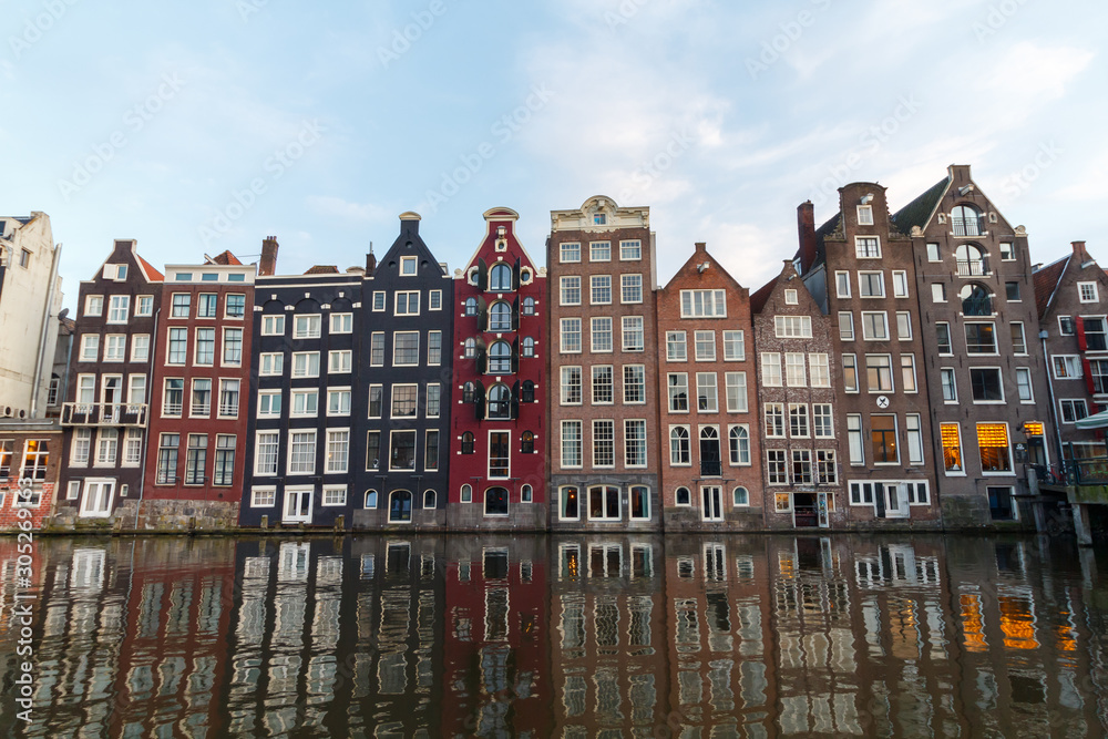 Tall Dutch style architecture next to water