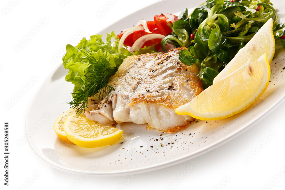 Fish dish - fried fish fillet with vegetables Fish dish - fried fish fillet with vegetables