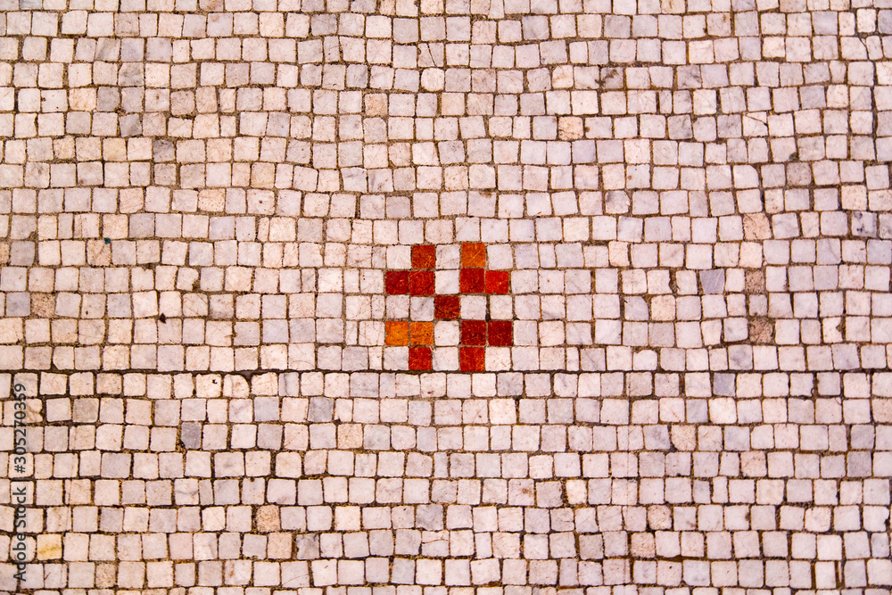 Ταπετσαρία Symbols embedded in tiled church floor