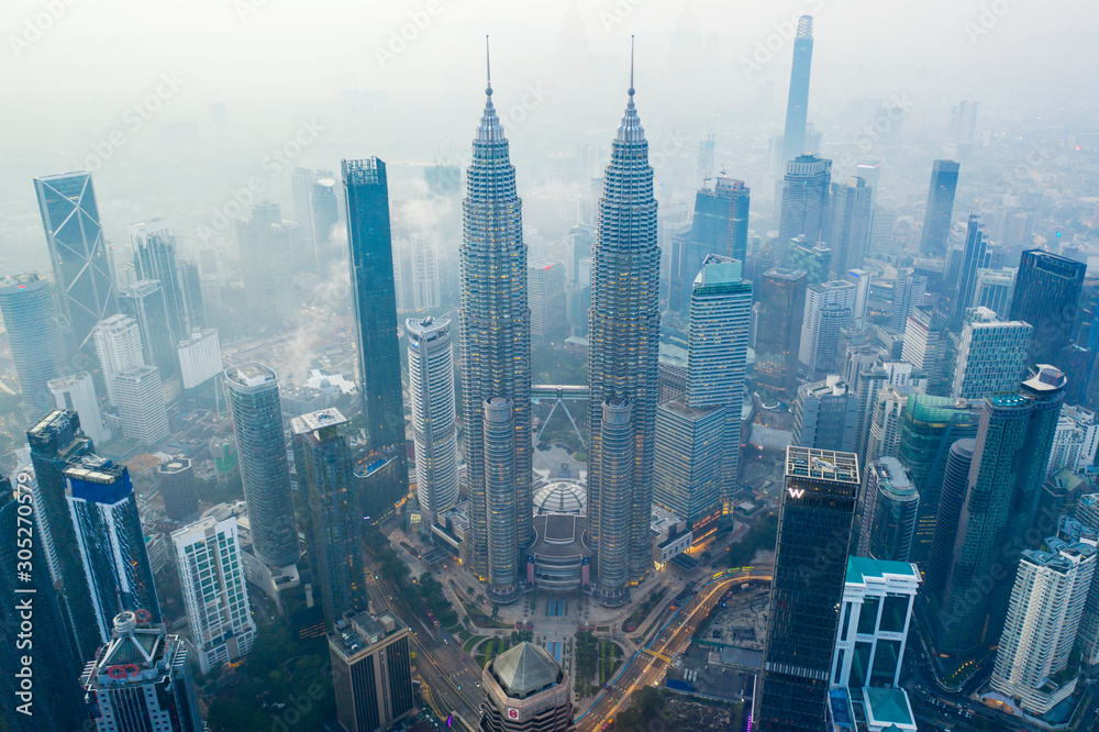 Petronas Twin Towers in foggy morning