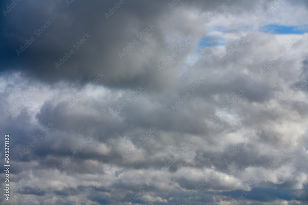 Fototapeta premium Clouds in the blue sky. Blue sky and volumetric white clouds.
