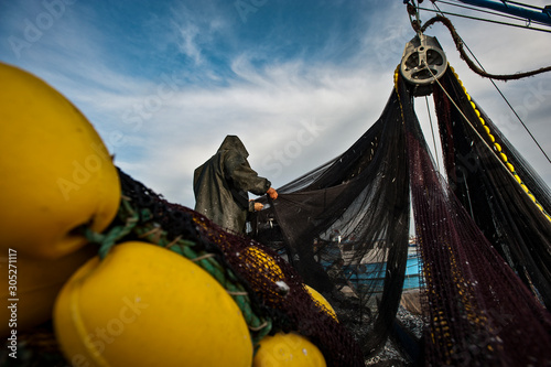 Εκτύπωση καμβά Fishermen in protective suits on deck Fishing vessel.