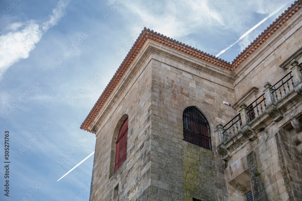 Viseu / Portugal - 04 16 2019 : Detailed view at the back facade of the Cathedral of Viseu, Se Cathedral de Viseu, architectural icon of the city of Viseu, Portugal