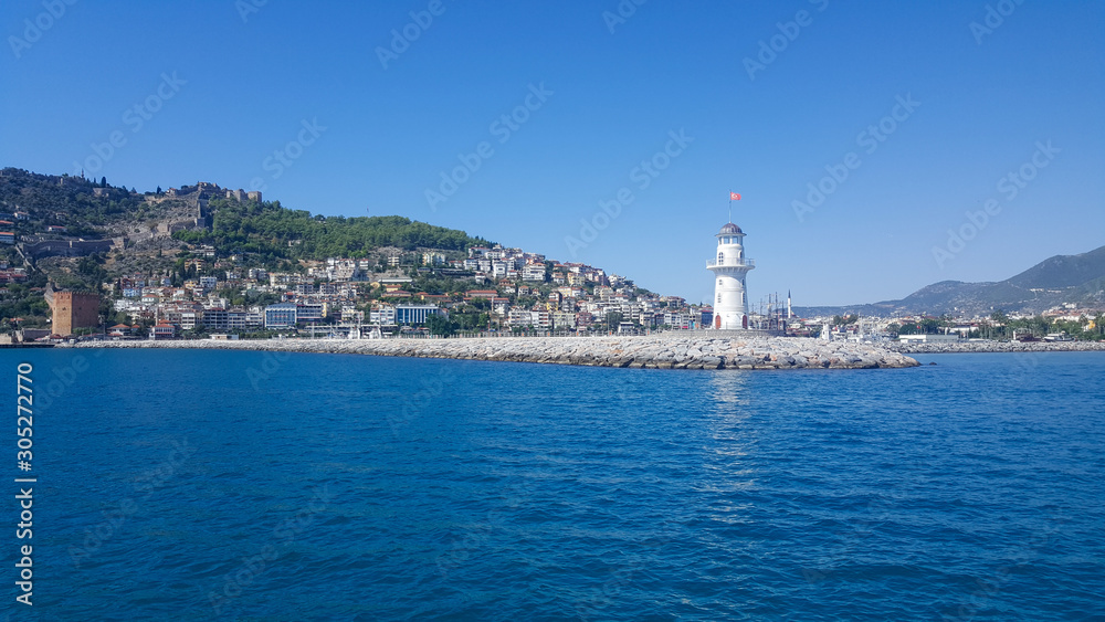 Lighthouse in the port of Alanya. Sea view of the lighthouse in Alanya Turkey.