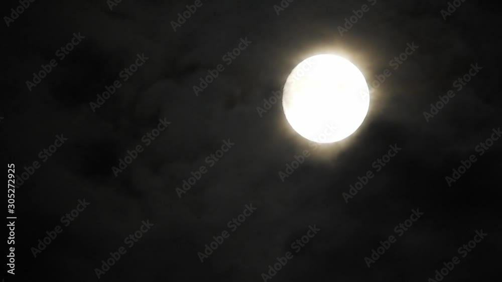 moon at night with cloud real time. 4k video full moon in the black sky. Clouds passing by moon at night. night sky with cloudy weather moon at night with cloud real time. 4k video full moon in the black sky. Clouds passing by moon at night. night sky with cloudy weather