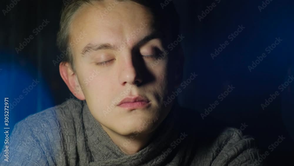 The viewer falls asleep while watching a movie or video. A tired colorist or videographer falls asleep in the workplace The viewer falls asleep while watching a movie or video. A tired colorist or videographer falls asleep in the workplace