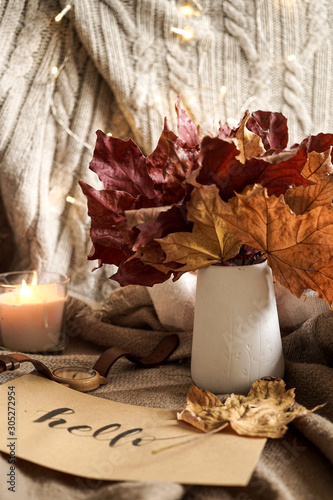 Autumnal still life with a candle and decorations