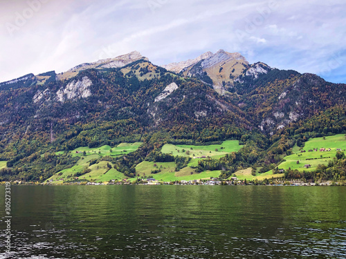 Mountain massif Pilatus or alpine Mount Pilatus over the Lake Lucerne or Vierwaldstaetersee lake (Vierwaldstattersee), Niederstad - Canton of Obwalden, Switzerland photo