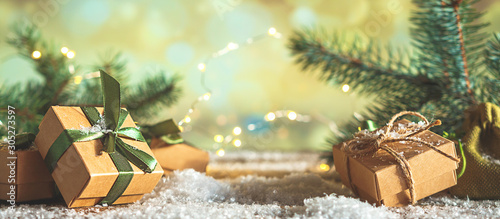 Christmas and zero waste, eco friendly packaging gifts in kraft paper on a wooden table, eco christmas holiday concept, eco decor banner