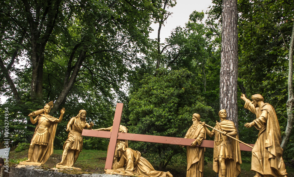Obraz premium Lourdes, France, June 24 2019: Way of the Cross of Jesus, Station VII - second fall under the cross
