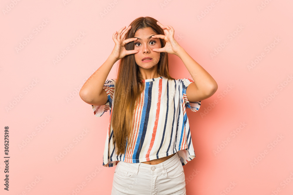 Young slim woman keeping eyes opened to find a success opportunity. Young slim woman keeping eyes opened to find a success opportunity.