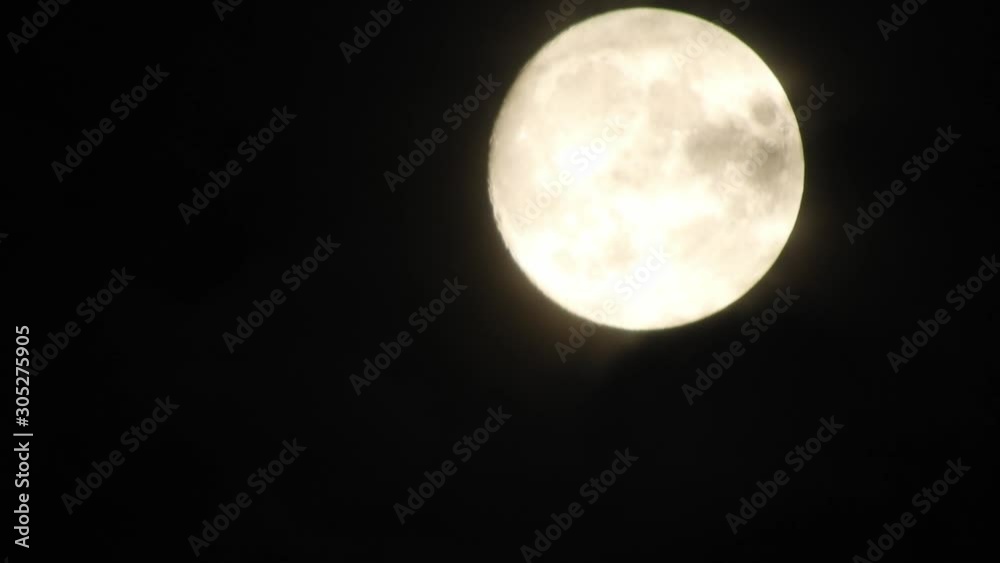 Full moon at night with cloud real time. 4k video full moon in the black sky. Clouds passing by moon at night. night sky with cloudy weather Full moon at night with cloud real time. 4k video full moon in the black sky. Clouds passing by moon at night. night sky with cloudy weather
