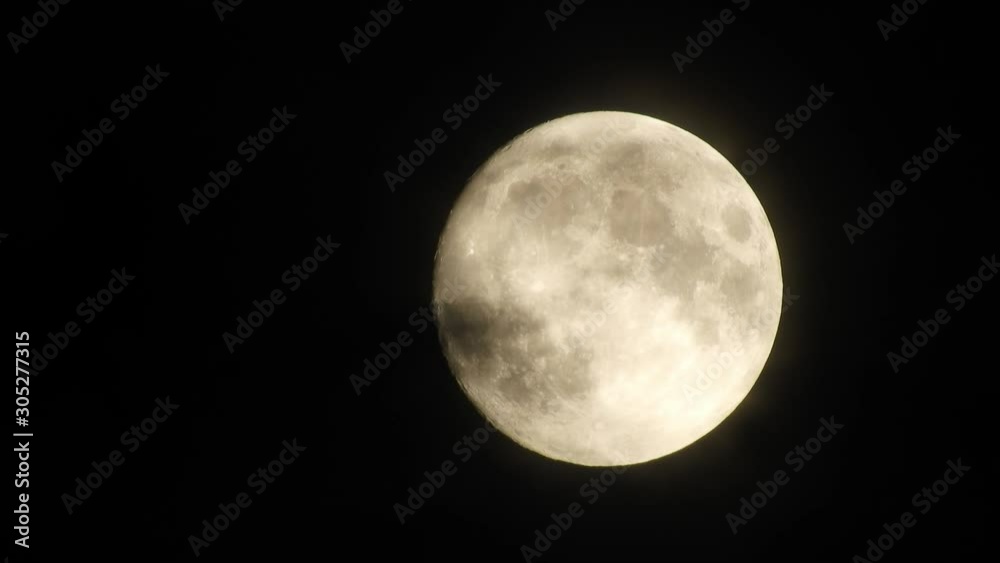 Full moon at night with cloud real time. 4k video full moon in the black sky. Clouds passing by moon at night. night sky with cloudy weather Full moon at night with cloud real time. 4k video full moon in the black sky. Clouds passing by moon at night. night sky with cloudy weather