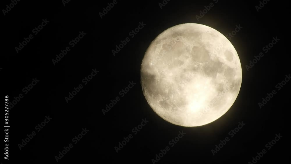Full moon at night with cloud real time. 4k video full moon in the black sky. Clouds passing by moon at night. night sky with cloudy weather Full moon at night with cloud real time. 4k video full moon in the black sky. Clouds passing by moon at night. night sky with cloudy weather