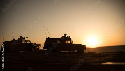 Photography Military patrol car on sunset background