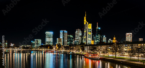 frankfurt skyline at night with colorful reflections in the main river, frankfurt am main, germany © Alexander