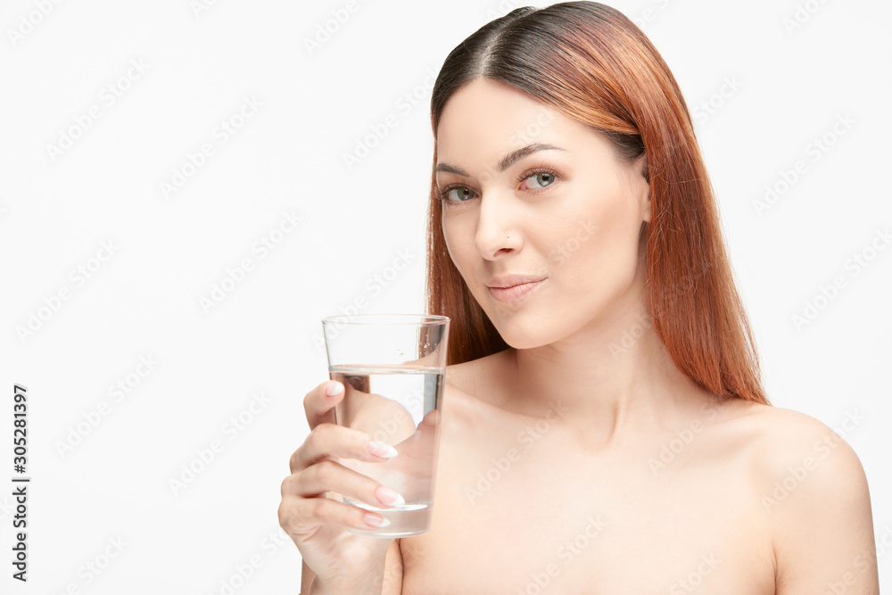 Portrait of a beautiful young woman with glass of water Portrait of a beautiful young woman with glass of water