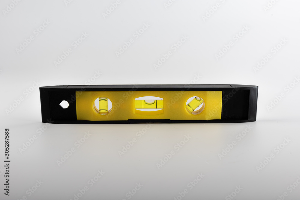A DIY spirit level photographed on white background A DIY spirit level photographed on white background