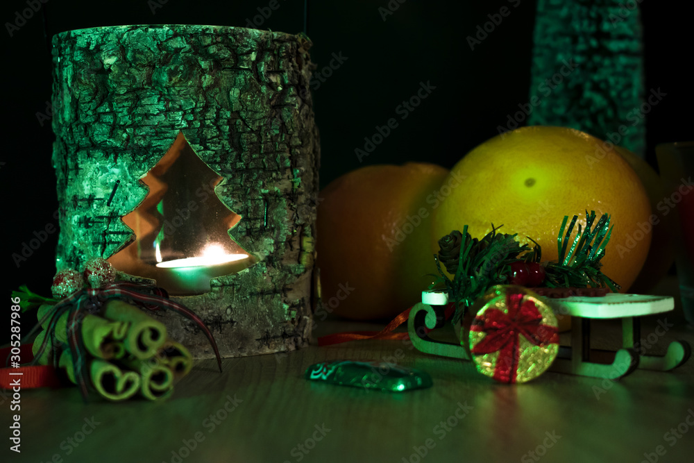 Dreamlike miniature for christmas. Candlestick light illuminates the Christmas table. Presents on a christmas table.