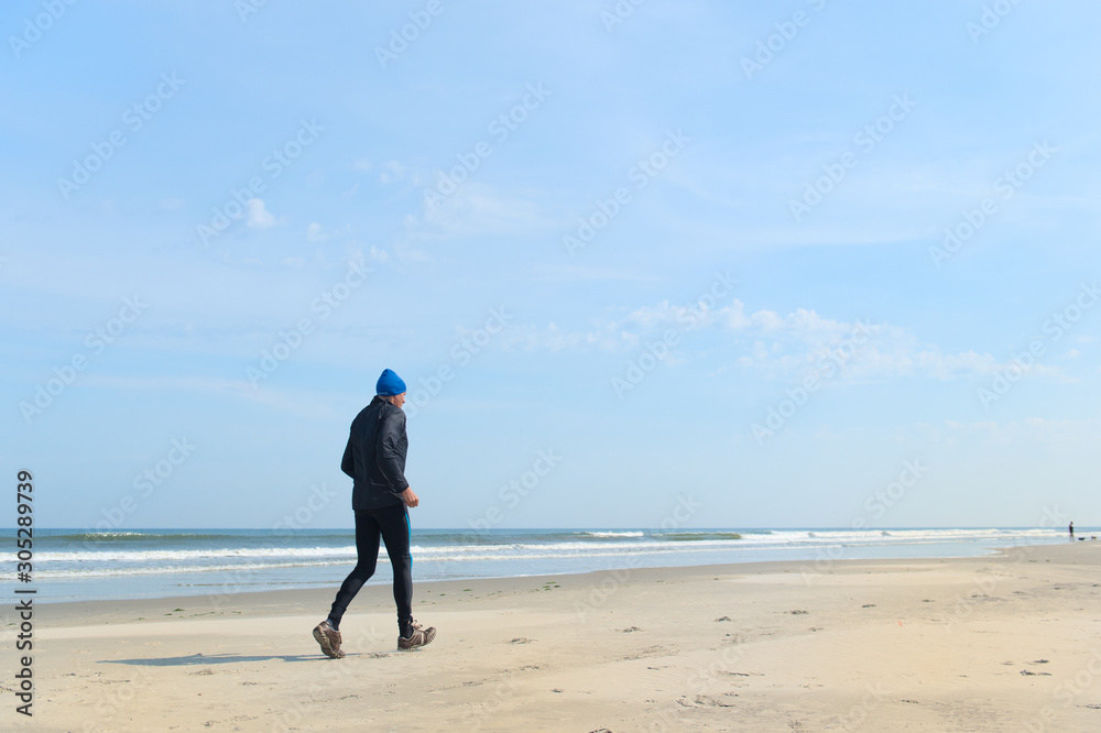 Senior man running at the beach Senior man running at the beach
