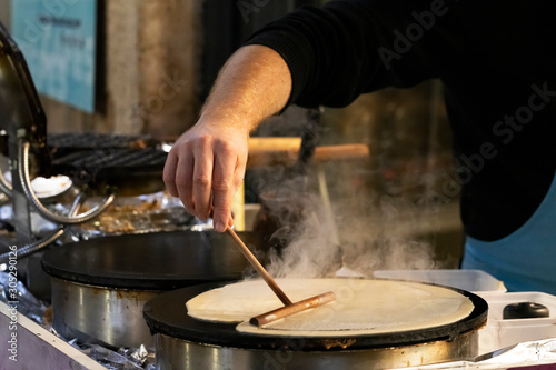 crepe maker in a street photo