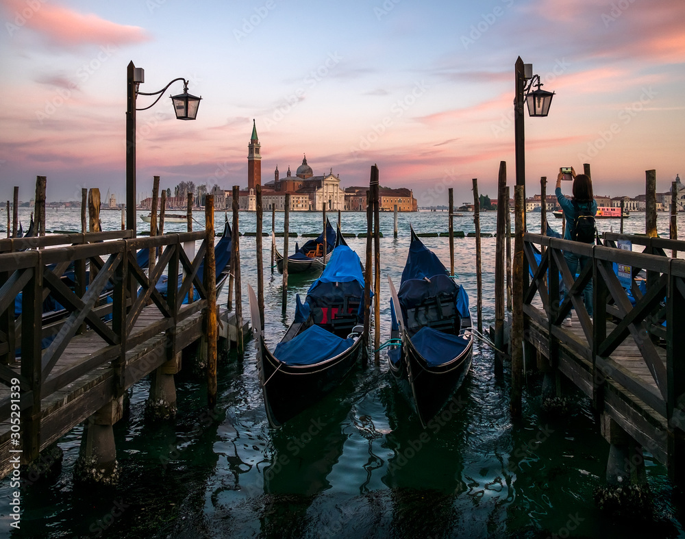 Venetian gondolas. Postcard views of old Venice. Venetian embankments. The romance of old Venice. Italy.