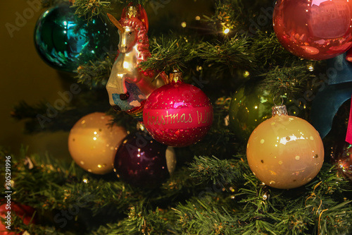 Christmas trees decorated with various bright toys