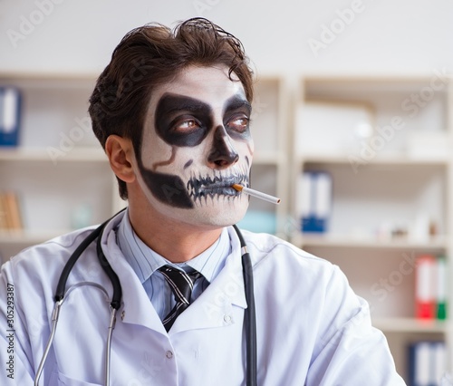 Scary monster doctor working in lab photo