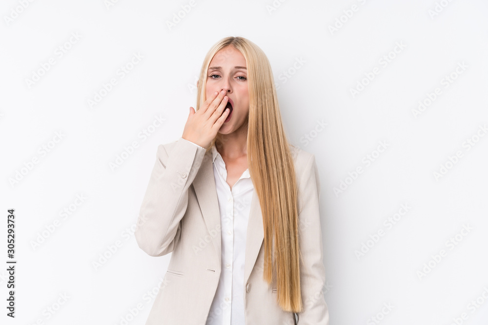Young business blonde woman on white background yawning showing a tired gesture covering mouth with hand. Young business blonde woman on white background yawning showing a tired gesture covering mouth with hand.