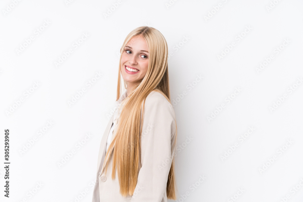 Young business blonde woman on white background looks aside smiling, cheerful and pleasant. Young business blonde woman on white background looks aside smiling, cheerful and pleasant.