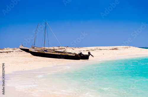 Typical outrigger fishermen pirogues moored on turquoise sea of Nosy Ve island, Indian Ocean, Madagascar