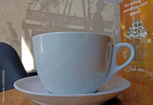 white coffee mug empty on the wooden table