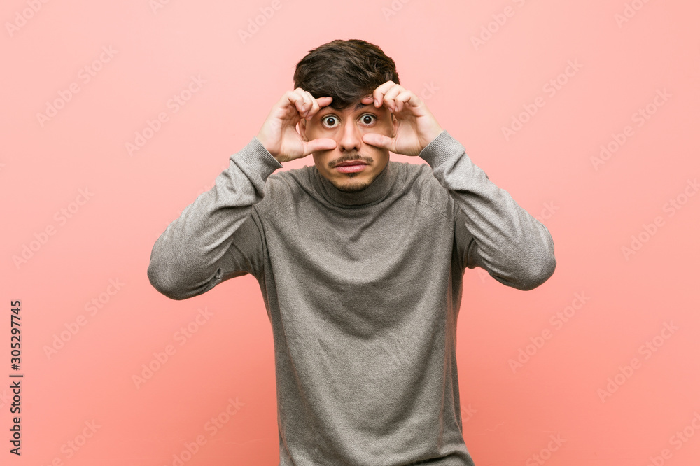 Young smart student man keeping eyes opened to find a success opportunity. Young smart student man keeping eyes opened to find a success opportunity.