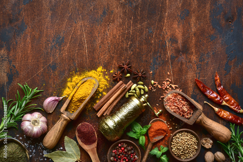 Assortment of spices and herbs. Top view with copy space. - obrazy, fototapety, plakaty 