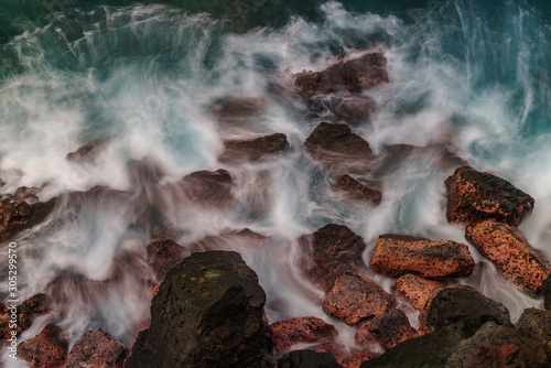 The Waves of the Sea Washing Over the Rocky Seashore © marknortona