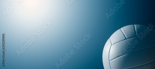 Canvas Print White leather volleyball detail on blue background